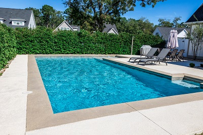 Swimming pool showing a newly place pool desk